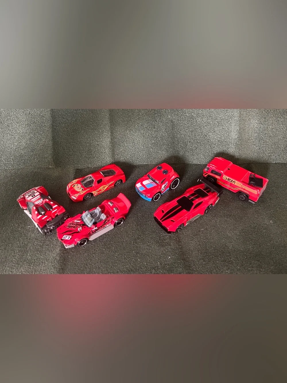 Red Assorted Brands of Die-Cast Racing Cars